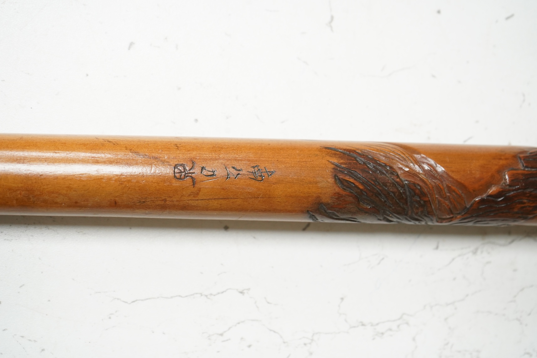 A late 19th century Japanese carved walking stick, with elephant handle, 95cm high